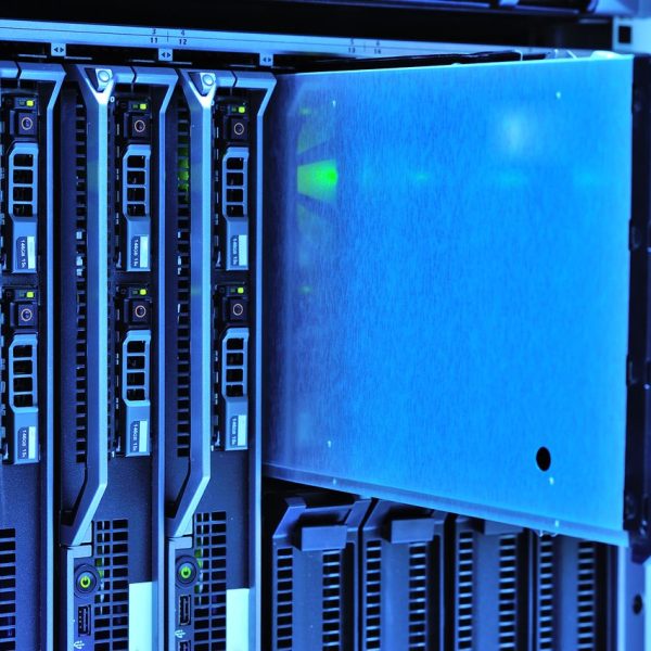 Detailed view of server racks with glowing lights in a data center environment.