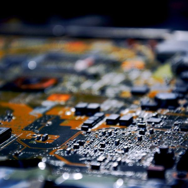 Detailed close-up view of electronic circuit board, showcasing modern technology.